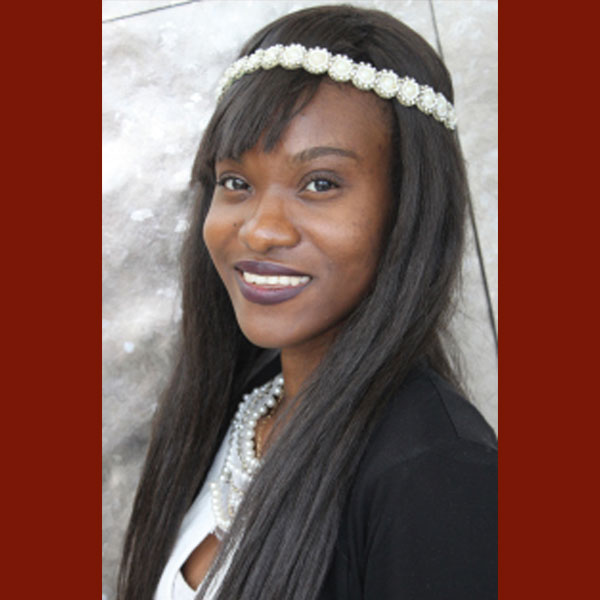 Portrait of Vanessa Wilson smiling at the camera.