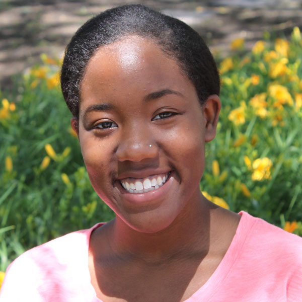 Portrait of Alexis Pulliam smiling at the camera.