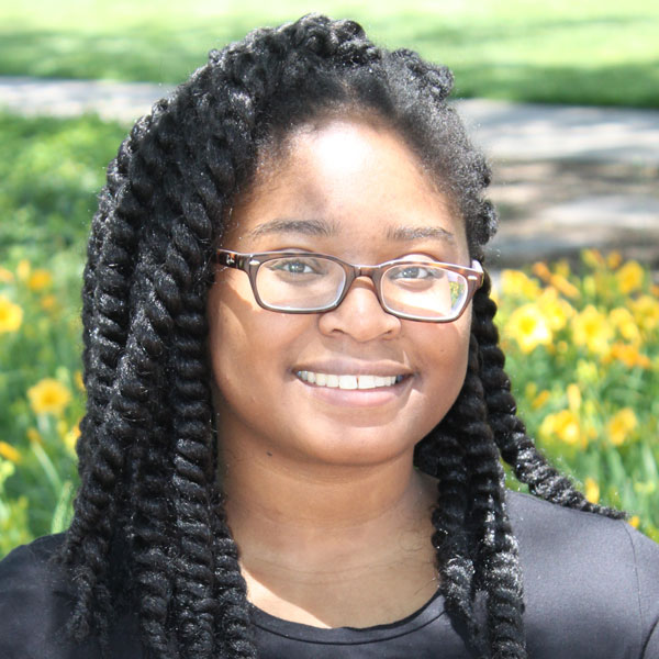 Portrait of Britney Hudson smiling at the camera.