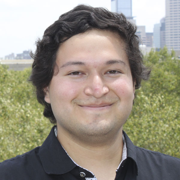 Portrait of Eduardo Salgado smiling at the camera.