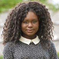 Portrait of Larissa Oglesby smiling at the camera.