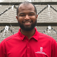 Portrait photo of Ravon Pittman smiling at the camera.