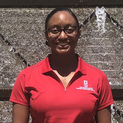 Portrait photo of Olivia Staples smiling at the camera.