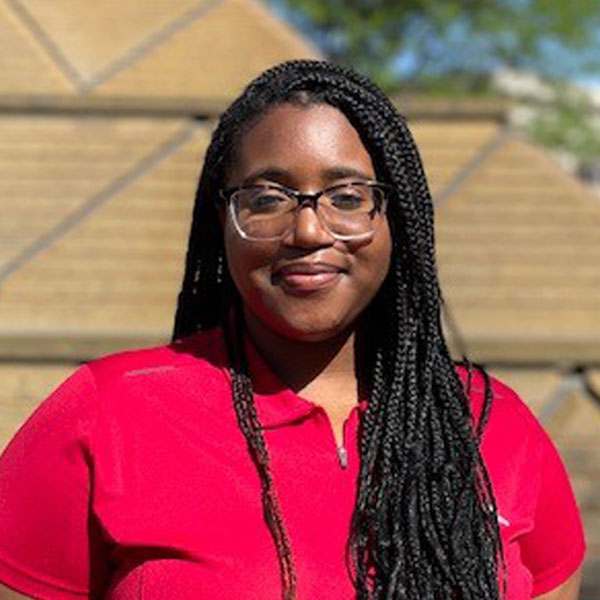 Portrait photo of Eriel Wise smiling at the camera.