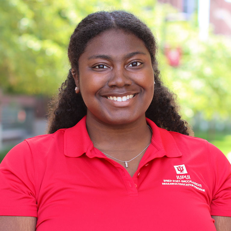 Portrait photo of Breianna Mildor smiling at the camera.