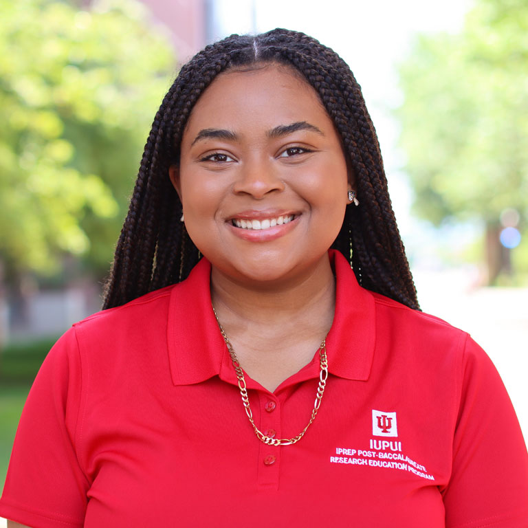 Portrait photo of Keyana Blake smiling at the camera.